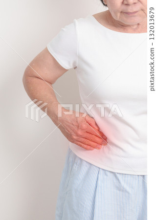 Elderly woman having side and Back Waist pain for Kidney disease, Urinary system and Stones, world Kidney and Cancer day, Chronic kidney, Organ Donor Day and Health care concept 132013679