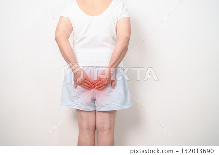 elderly Woman having Anal symptoms pain for Hemorrhoids disease, Constipation, Anal cancer awareness month, diarrhea, Irritable Bowel Syndrome, IBS, Inflammation, Colorectal cancer and Anal Procttis 132013690