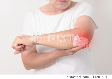 Elderly Woman having elbow ache with Medicated pain relief patch plaster for concepts of Tennis Elbow, muscle pain and Sprain, lateral epicondylitis, Bursitis, injury, Senior Health care and medical Elderly Woman having elbow ache with Medicated pain relief patch plaster for concepts of Tennis Elbow, muscle pain and Sprain, lateral epicondylitis, Bursitis, injury, Senior Health care and medical 132013918