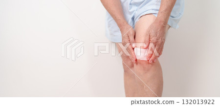 Elderly woman having knee ache with Medicated pain relief patch plaster to Runners Knee or Patellofemoral Pain Syndrome, osteoarthritis, arthritis, rheumatism and Patellar Tendinitis. Senior health Elderly woman having knee ache with Medicated pain relief patch plaster to Runners Knee or Patellofemoral Pain Syndrome, osteoarthritis, arthritis, rheumatism and Patellar Tendinitis. Senior health 132013922