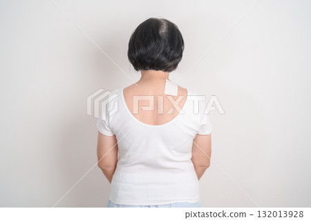 Elderly Woman having Shoulder Pain with Medicated pain relief patch plaster for Muscle Inflammation and Sprain, Myofascial ache syndrome and Fibromyalgia, Shoulder Myalgia and Scapular Tightness 132013928