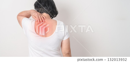 Business woman having back ache with Medicated pain relief patch plaster for Back Muscle Strain, Scapular Muscle Tightness, Piriformis Syndrome, Osteoporosis, Spinal Compression and Health care 132013932