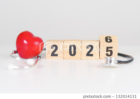 2025 end year to Happy New Year 2026 with Stethoscope of doctor and heart shape on table. health care, Insurance, Wellness and medical concepts 132014131