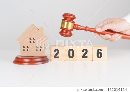 Happy New Year 2026 with small toy house model with gavel justice hammer on desk in courthouse. Real Estate Law, Home Insurance, property Tax, Auction and Bidding concepts Happy New Year 2026 with small toy house model with gavel justice hammer on desk in courthouse. Real Estate Law, Home Insurance, property Tax, Auction and Bidding concepts 132014134