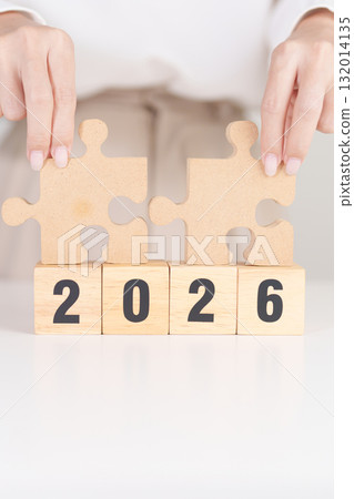 2026 year block with jigsaw puzzle icon. Business Process, Team, teamwork, Goal, mission, Resolution, strategy, plan, Action, partnership, and New Year start 132014135