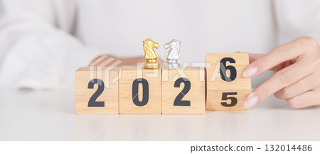 Happy New Year 2025 change to 2026 year block with horse chess. Year of the Horse, animals of the Chinese zodiac, horoscope, success and good fortune 132014486