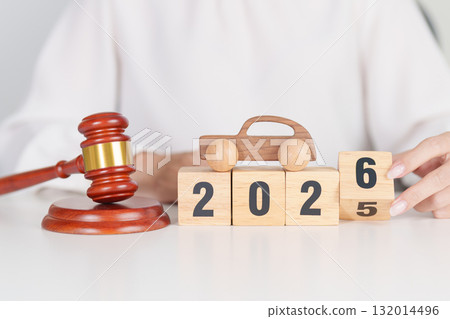 2025 end year to Happy New Year 2026 with small toy car models and Judges gavel on desk in courthouse. Car Law, Insurance, auto Tax, Auction and Bidding concepts 2025 end year to Happy New Year 2026 with small toy car models and Judges gavel on desk in courthouse. Car Law, Insurance, auto Tax, Auction and Bidding concepts 132014496