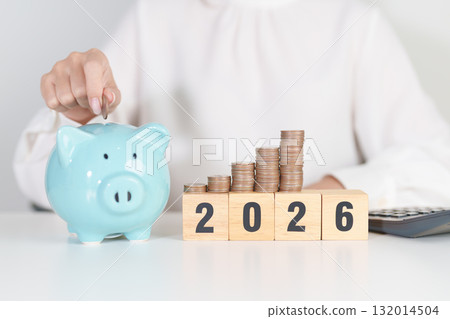 Happy New Year 2026 with piggy bank. Resolution, Goals, Plan, Action, Money Saving, Retirement fund, Pension, Investment and Financial concepts 132014504