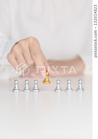 Hand hold golden chess pawn pieces or leader businessman stand out of crowd people of silver men. leadership, business, team, teamwork and Human resource management concept 132014823