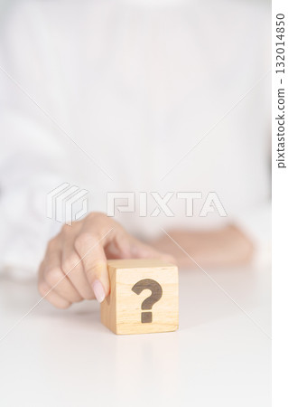 Wood block of Questions Mark sign. FAQ, frequency asked questions, Answer, Q and A, Information, Communication, problem and interrogation Concepts 132014850