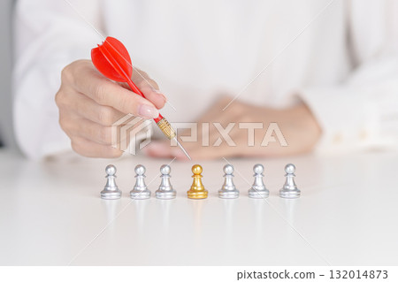 Hand point dart to golden chess pawn pieces or leader businessman stand out of crowd people of silver men. leadership, business, team, teamwork, unique and Human resource management concept Hand point dart to golden chess pawn pieces or leader businessman stand out of crowd people of silver men. leadership, business, team, teamwork, unique and Human resource management concept 132014873
