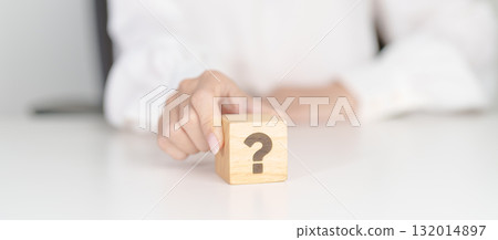 Wood block of Questions Mark sign. FAQ, frequency asked questions, Answer, Q and A, Information, Communication, problem and interrogation Concepts 132014897