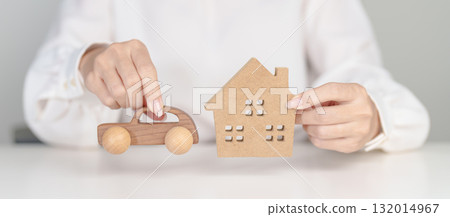 house and Car model on table. real estate, Home mortgage and car loan, tax, investment, financial, savings, interest rate, economic recession 132014967