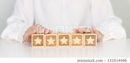 hand show Star block. Customer choose rating for user reviews. Service rating, ranking, customer review, satisfaction, evaluation and feedback concept hand show Star block. Customer choose rating for user reviews. Service rating, ranking, customer review, satisfaction, evaluation and feedback concept 132014996