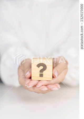 Wood block of Questions Mark sign. FAQ, frequency asked questions, Answer, Q and A, Information, Communication, problem and interrogation Concepts 132015000