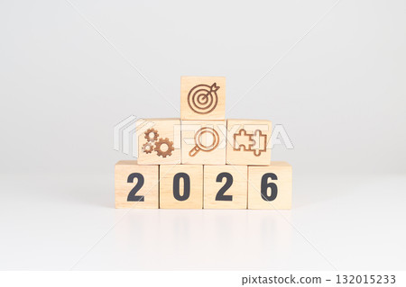 Happy New Year 2026 block with wood block with business goal, strategy, target, mission, action, objective, teamwork, research, feedback and idea concept 132015233