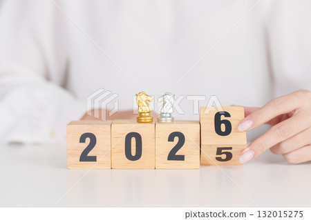 Happy New Year 2025 change to 2026 year block with horse chess. Year of the Horse, animals of the Chinese zodiac, horoscope, success and good fortune 132015275