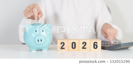 Happy New Year 2026 with piggy bank. Resolution, Goals, Plan, Action, Money Saving, Retirement fund, Pension, Investment and Financial concepts 132015290