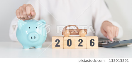 Happy New Year 2026 with car model and Coins Money stack for deposit and Automobile Tax. Money Saving, Car Insurance, Financial, vehicle Repair and Maintenance and New Year concept 132015291