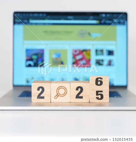 2025 end year to Happy New Year 2026 block magnifying glass icon against laptop background. Hiring, recruitment, job, jobless SEO, Search Engine Optimization and New Year concepts 132015435