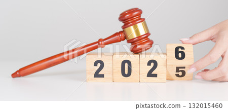 2025 end year to Happy New Year 2026 with judge gavel on table. Law, lawyer, judgment, justice auction and bidding concept 132015460