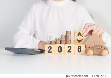 2026 New Year with percentage change to UP and Down arrow, car and Home model with coin stack. Car loan, Interest rate, real estate, house, Insurance, Financial, Repair, Tax, mortgage and Maintenance 132015510
