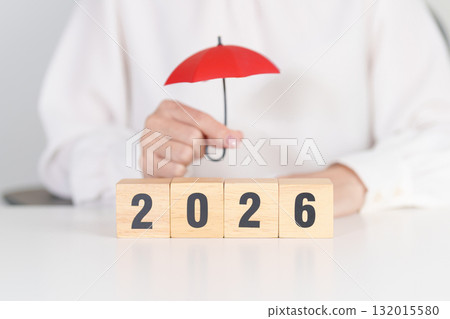 Happy New Year 2026 with hand holding red umbrella. Insurance, protection, safety and New year holiday Concepts Happy New Year 2026 with hand holding red umbrella. Insurance, protection, safety and New year holiday Concepts 132015580