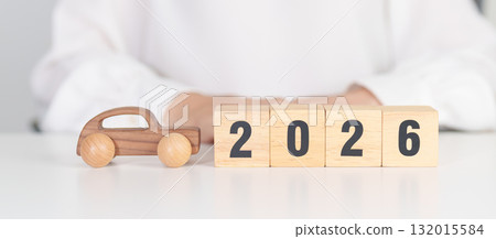 Happy New Year 2026 with Car model on table. Automobile Tax, Car Insurance, Financial, vehicle Repair and Maintenance and New Year concept 132015584