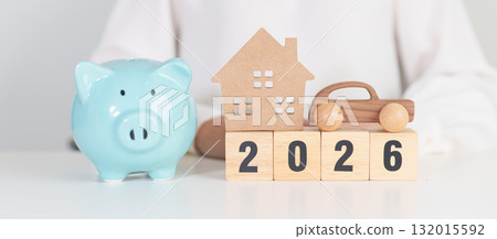 Happy New Year 2026 with car and Home model with coin stack. Car loan, Interest rate, real estate, house, Insurance, Financial, Repair, Tax, mortgage and Maintenance 132015592