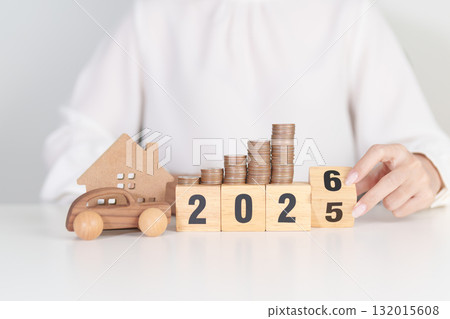 2025 end year to Happy New Year 2026 with car and Home model with coin stack. Car loan, Interest rate, real estate, house, Insurance, Financial, Repair, Tax, mortgage and Maintenance 132015608