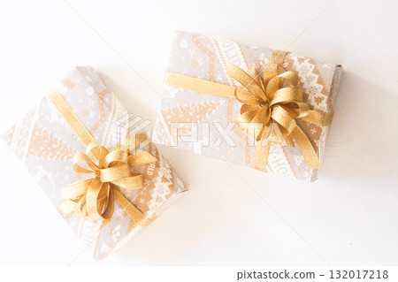 Christmas pattern wrapping gift with gold ribbon Christmas pattern wrapping gift with gold ribbon 132017218