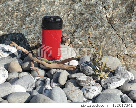Plastic red beauty jar against backdrop of natural elements. Cosmetics and facial and hair care. Mock-up template for design. Eco-friendly products. Background, design composition. Plastic red beauty jar against backdrop of natural elements. Cosmetics and facial and hair care. Mock-up template for design. Eco-friendly products. Background, design composition. 132017341