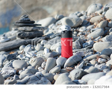 Plastic red beauty jar against backdrop of natural elements. Cosmetics and facial and hair care. Mock-up template for design. Eco-friendly products. Background, design composition. Plastic red beauty jar against backdrop of natural elements. Cosmetics and facial and hair care. Mock-up template for design. Eco-friendly products. Background, design composition. 132017364