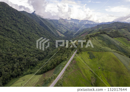 Landscape of Morning Mist with Mountain Layer. mountain ridge and clouds in rural jungle bush forest Landscape of Morning Mist with Mountain Layer. mountain ridge and clouds in rural jungle bush forest 132017644