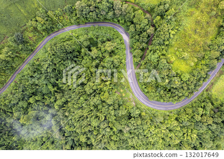 Landscape of Morning Mist with Mountain Layer. mountain ridge and clouds in rural jungle bush forest Landscape of Morning Mist with Mountain Layer. mountain ridge and clouds in rural jungle bush forest 132017649
