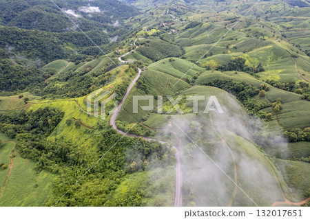 Landscape of Morning Mist with Mountain Layer. mountain ridge and clouds in rural jungle bush forest 132017651