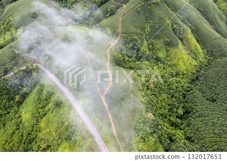 Landscape of Morning Mist with Mountain Layer. mountain ridge and clouds in rural jungle bush forest 132017653