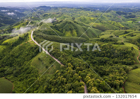 Landscape of Morning Mist with Mountain Layer. mountain ridge and clouds in rural jungle bush forest 132017654