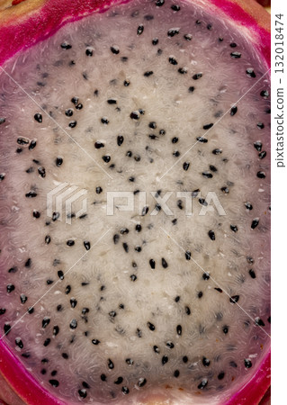 red pitaya cut in half with lots of small black seeds and white soft sweet flesh inside, sweet ripe dragon fruit with black small seeds and light flesh cut in half red pitaya cut in half with lots of small black seeds and white soft sweet flesh inside, sweet ripe dragon fruit with black small seeds and light flesh cut in half 132018474