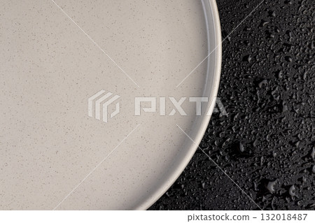 a white ceramic bowl with small dots on the surface, made of baked clay and painted in light paint a food bowl 132018487