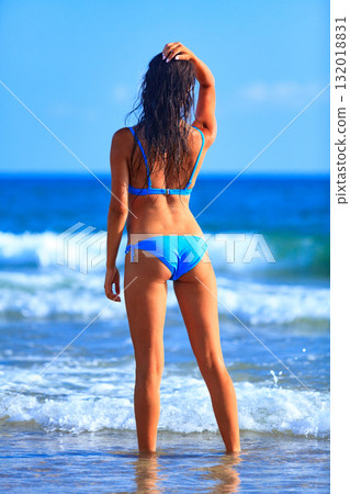 Sexy gorgeous woman with beautiful slim body is posing on a sandy sea beach, summer holidays concept, pretty girl Sexy gorgeous woman with beautiful slim body is posing on a sandy sea beach, summer holidays concept, pretty girl 132018831