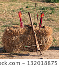 Crossbow and arrows on the straw block 132018875
