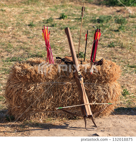 Crossbow and arrows on the straw block Crossbow and arrows on the straw block 132018875
