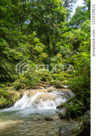 Small river and waterfall in Tentena rainforest, Sulawesi, Indonesia Small river and waterfall in Tentena rainforest, Sulawesi, Indonesia 132019822