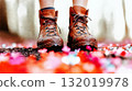 Hiker walking on fallen flower petals in spring forest 132019978