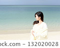 Woman relaxing by the sea in winter 132020028