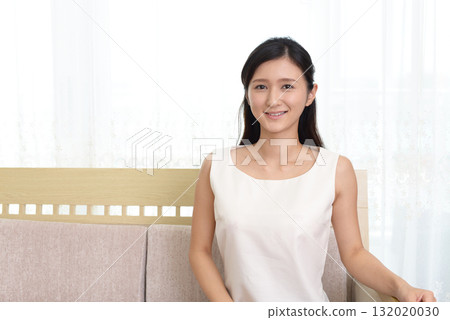 A woman relaxing on the sofa 132020030