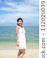 woman relaxing on the beach 132020039