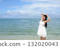 woman relaxing on the beach 132020043