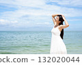 woman relaxing on the beach 132020044